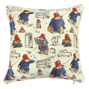 Paddington bear cushion with a colourful bear in a blue coat wandering around london 